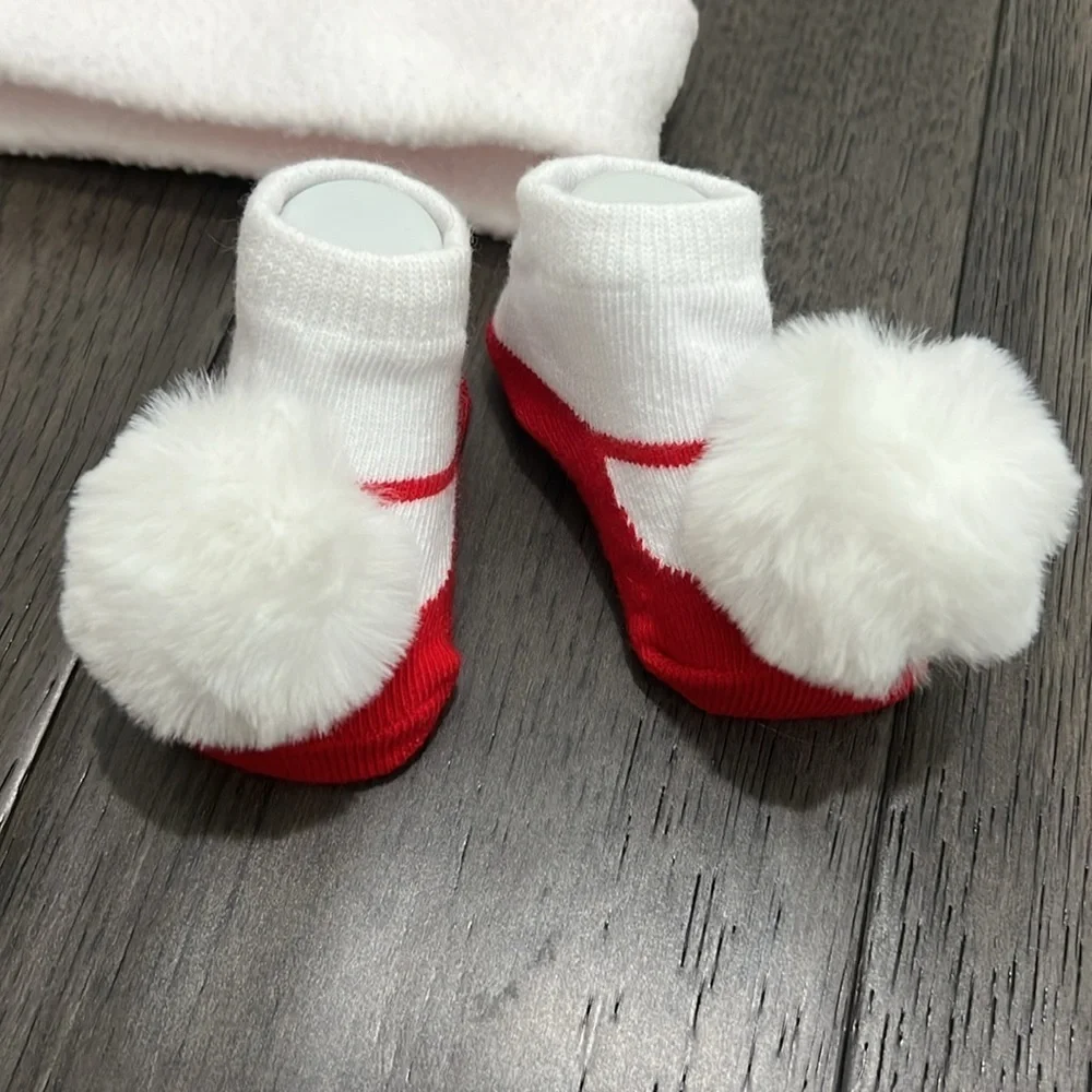 NWOT infant Santa hat with matching sock booties with pom-poms
